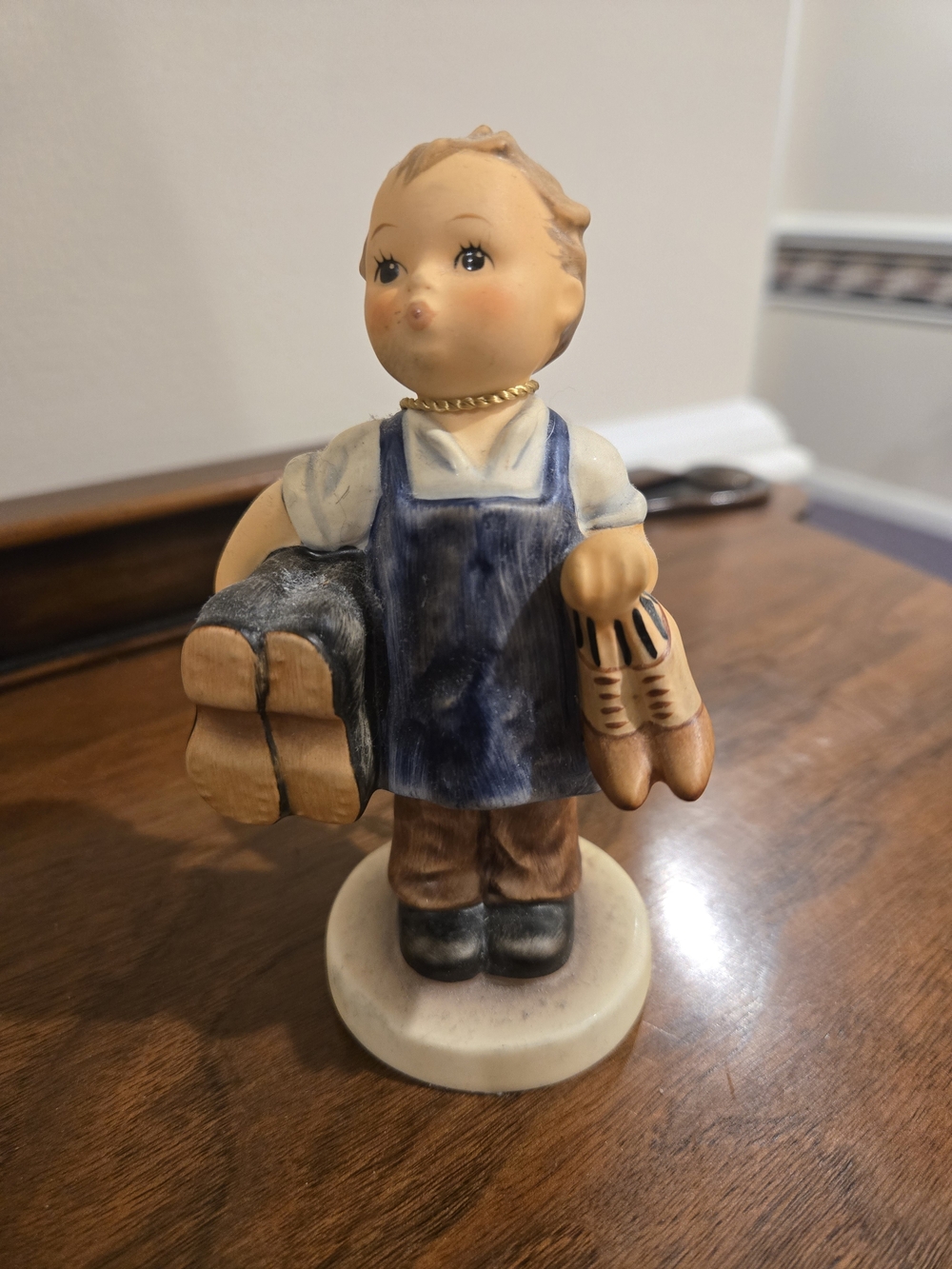 Hummel Boy Figurine in Blue Apron with Brown Accents